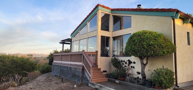 view of property exterior at dusk