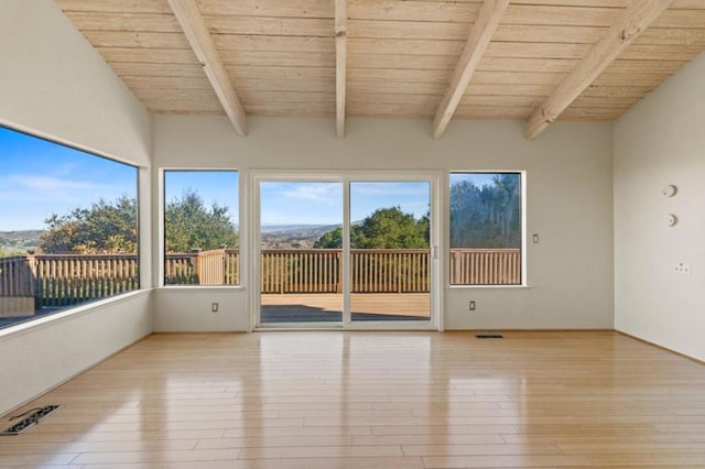 unfurnished sunroom featuring beam ceiling and wooden ceiling