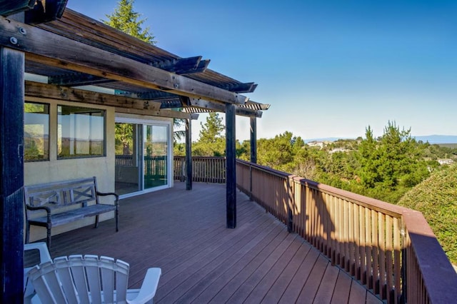 wooden deck featuring a pergola