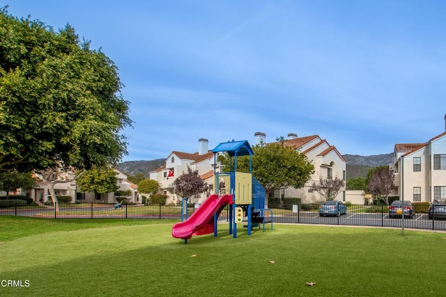 view of play area with a yard