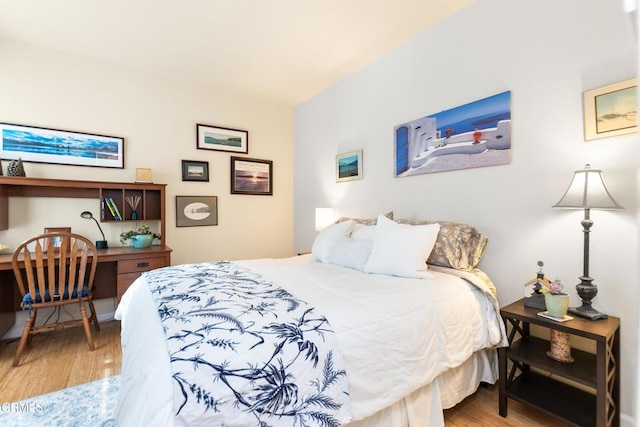 bedroom featuring wood-type flooring