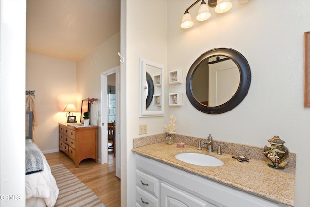 bathroom with vanity and hardwood / wood-style flooring