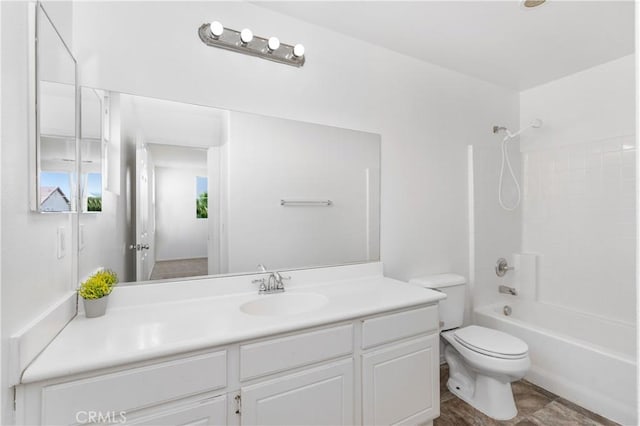 full bathroom featuring toilet, bathtub / shower combination, and vanity