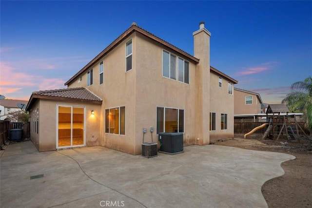 1567 Preston Dr, Perris, CA 92571 - rear view of house with stucco siding, a patio, a tile roof, and a fenced backyard