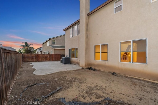 1567 Preston Dr, Perris, CA 92571 - back of property featuring a patio area, stucco siding, and a fenced backyard