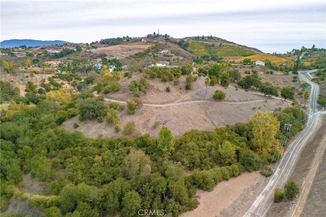 drone / aerial view featuring a mountain view