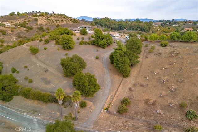 aerial view with a mountain view and a rural view