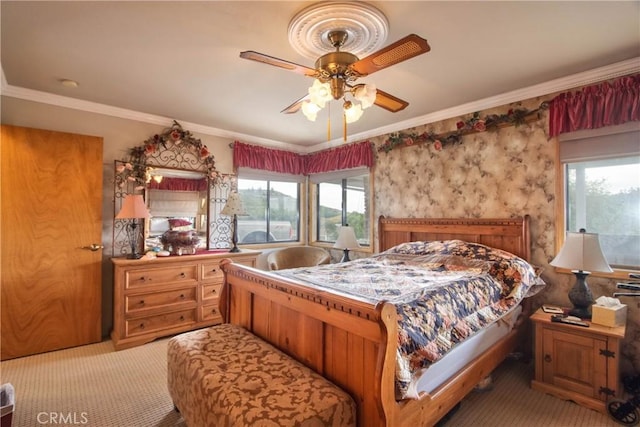 bedroom with carpet flooring, multiple windows, ceiling fan, and ornamental molding