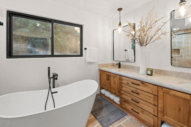 bathroom with vanity and a bath