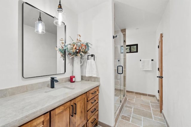 bathroom with an enclosed shower and vanity