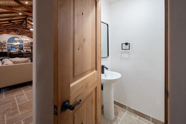 bathroom with wood ceiling and vaulted ceiling