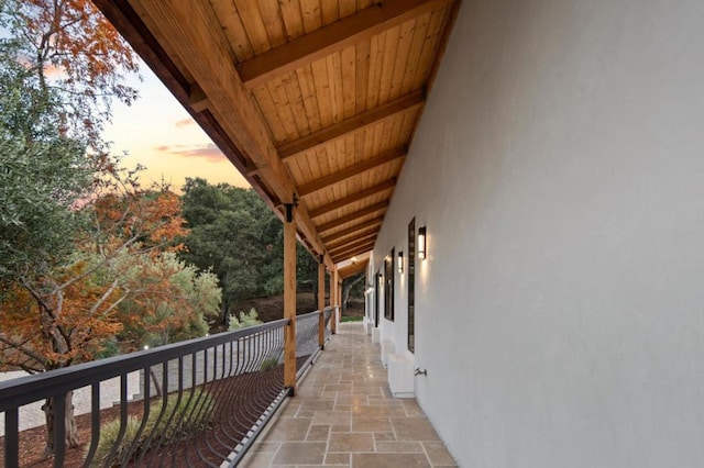 view of balcony at dusk