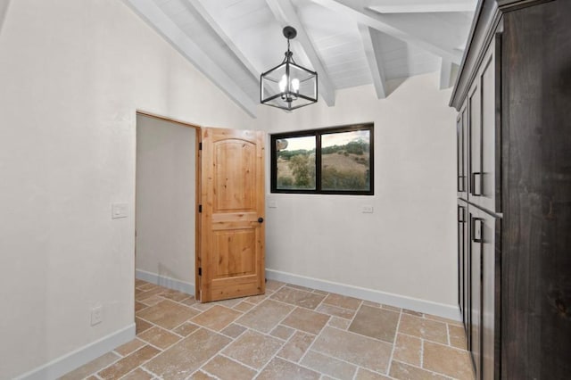 unfurnished room featuring vaulted ceiling with beams, a chandelier, and wooden ceiling