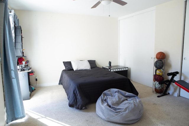 bedroom with ceiling fan and light colored carpet