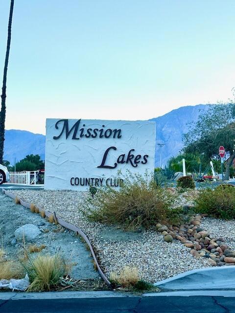 community sign featuring a mountain view