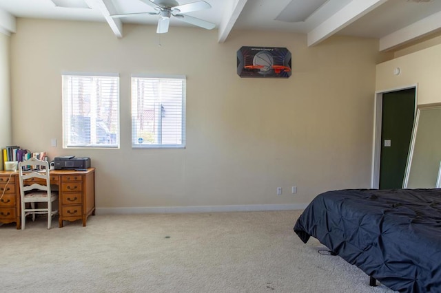 carpeted bedroom featuring ceiling fan and beamed ceiling