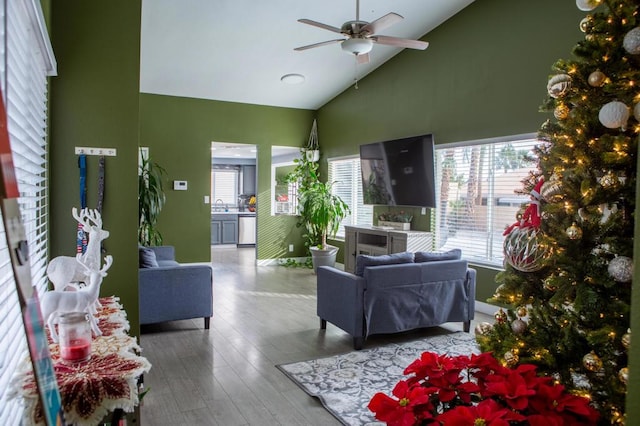 living room featuring ceiling fan, sink, wood-type flooring, and high vaulted ceiling