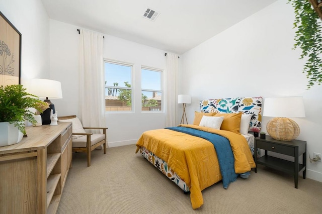 bedroom with light colored carpet