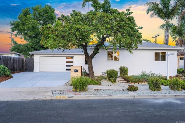 ranch-style home featuring a garage