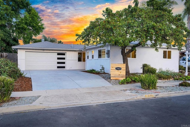 single story home with a garage