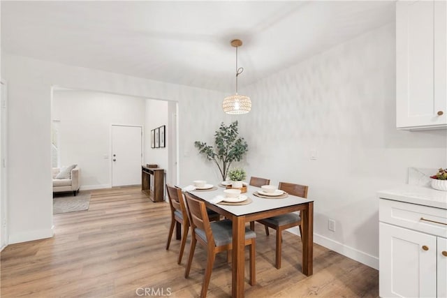 dining area with light hardwood / wood-style flooring