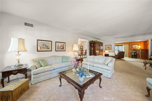 living room featuring light carpet