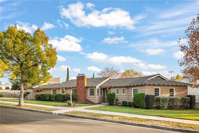 single story home featuring a front yard