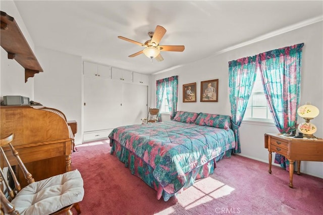 bedroom featuring ceiling fan and carpet floors