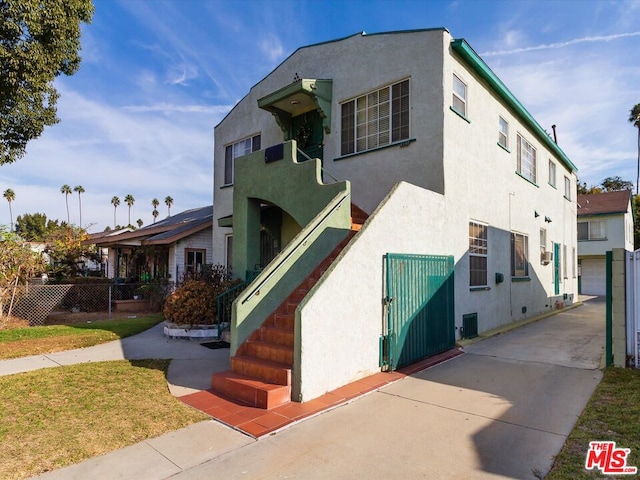 view of front of house with central air condition unit