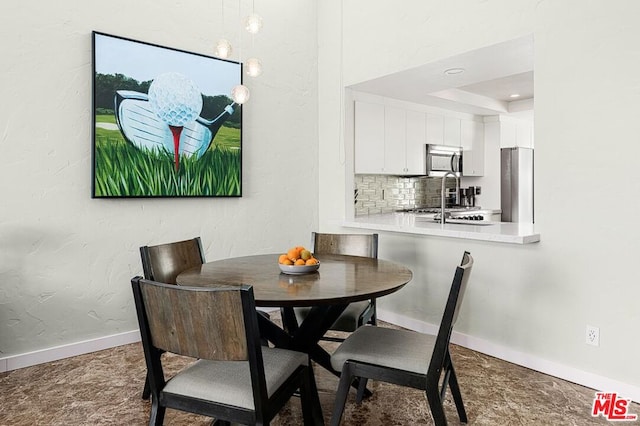 dining room featuring a raised ceiling