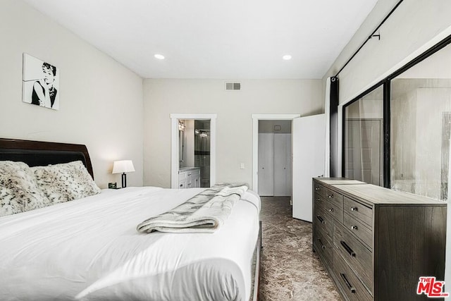 bedroom featuring ensuite bath