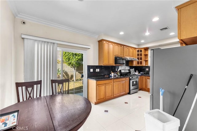 kitchen featuring dark stone countertops, decorative backsplash, crown molding, appliances with stainless steel finishes, and light tile patterned floors