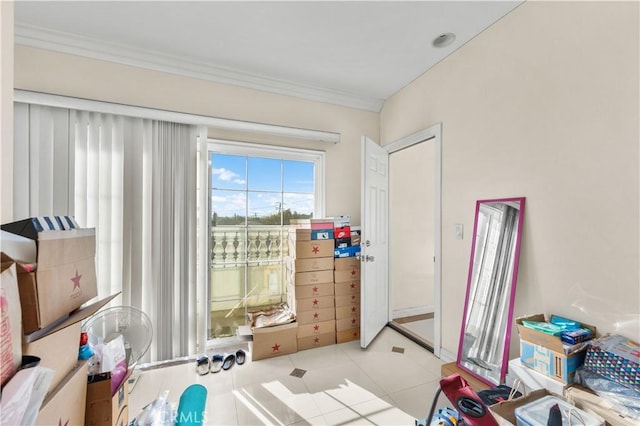 interior space featuring light tile patterned floors and crown molding