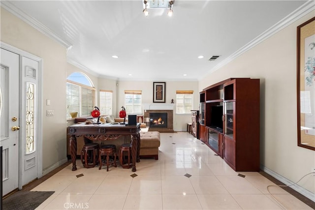 living room with light tile patterned floors and crown molding