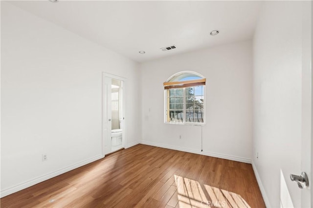 empty room featuring wood-type flooring