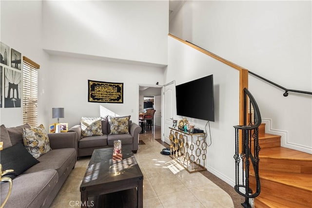 tiled living room with a high ceiling