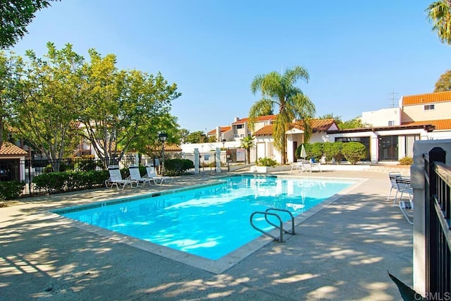 view of swimming pool with a patio