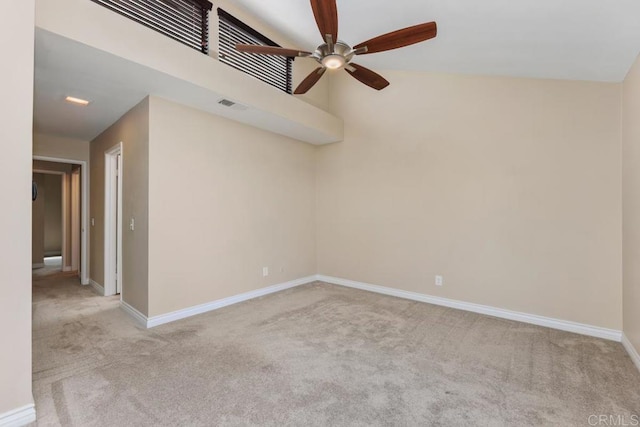 carpeted spare room featuring ceiling fan