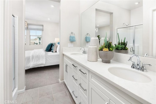 bathroom with vanity and a shower with shower door