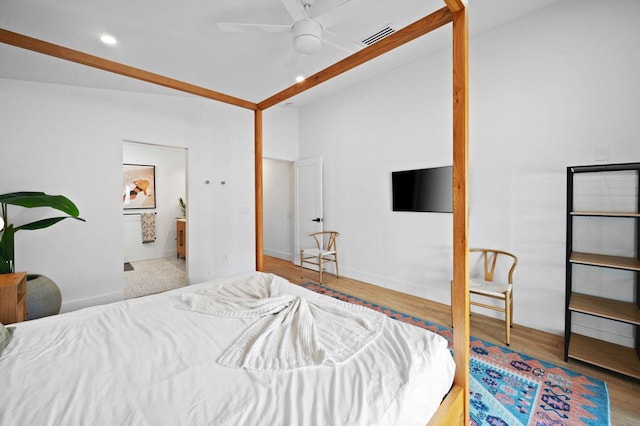 bedroom with lofted ceiling, ceiling fan, and light hardwood / wood-style flooring