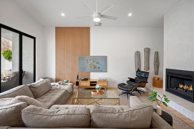 living room with ceiling fan and hardwood / wood-style floors