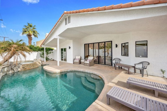 view of swimming pool with a patio