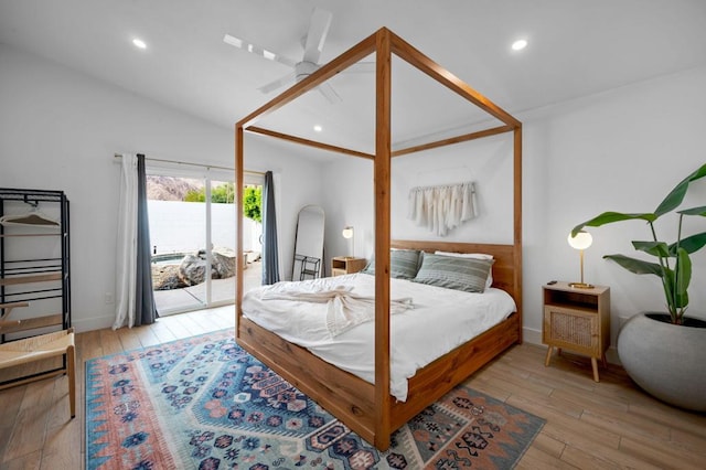 bedroom with ceiling fan, access to exterior, lofted ceiling, and light hardwood / wood-style floors