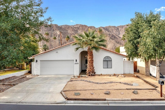 view of front of house with a mountain view and a garage