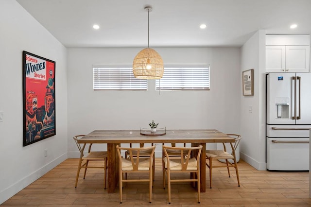 dining area featuring light wood-type flooring