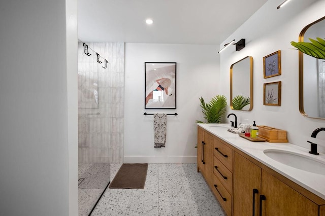 bathroom with a shower and vanity