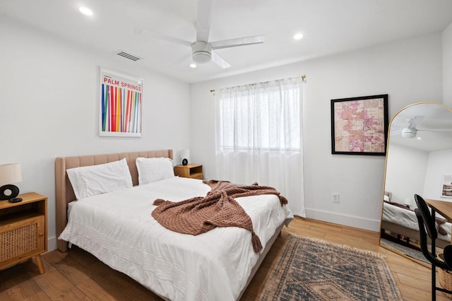 bedroom featuring ceiling fan and hardwood / wood-style floors