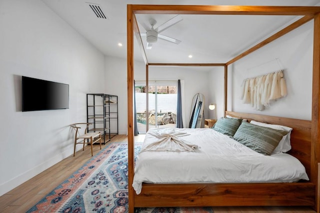 bedroom featuring ceiling fan, hardwood / wood-style flooring, and access to outside