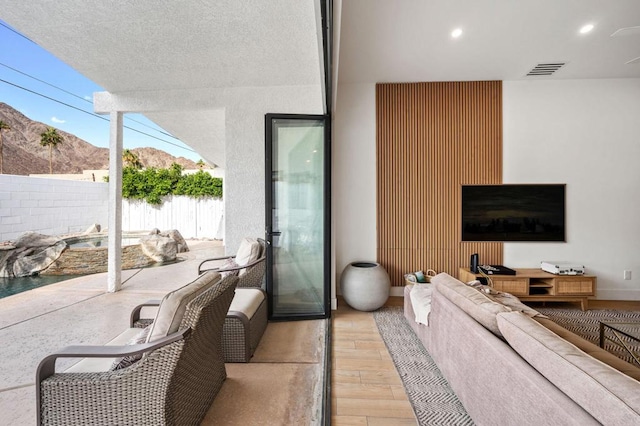 interior space featuring an outdoor living space and a mountain view