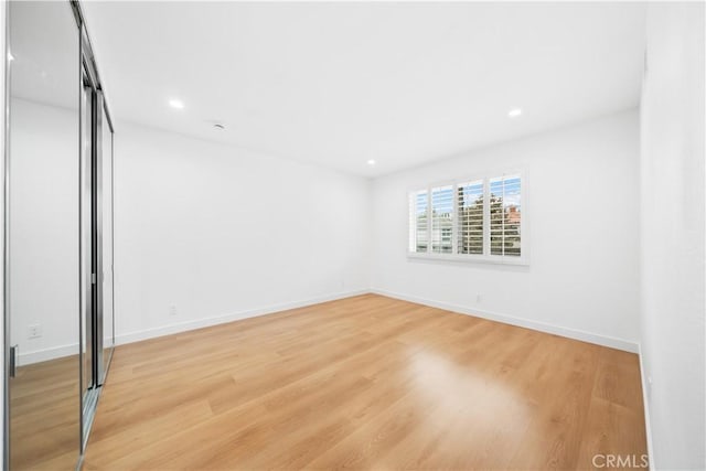 unfurnished bedroom featuring light wood-type flooring